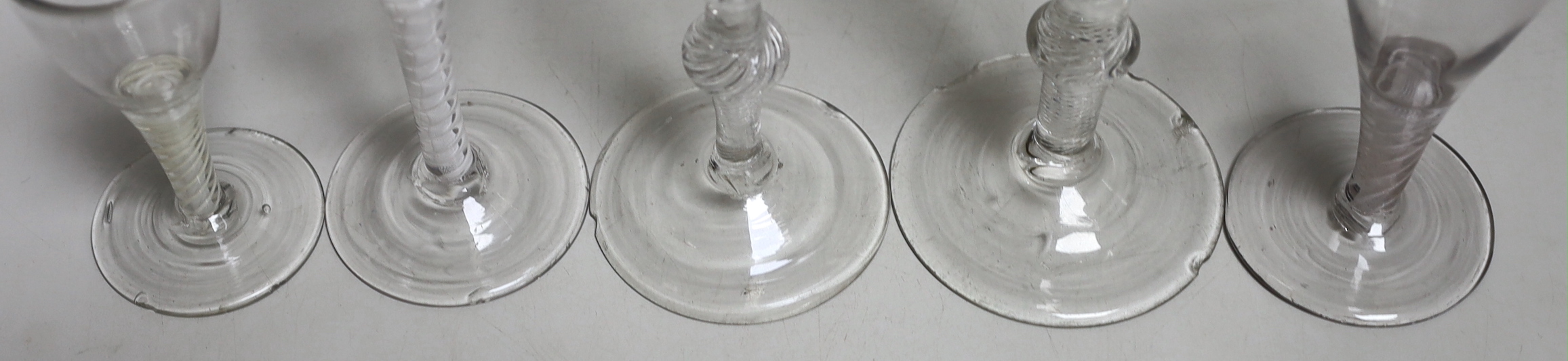 Two George II airtwist stem cordial or wine glasses, tallest 20cm high, a George III DSOT wine glass and two Continental DSOT glasses